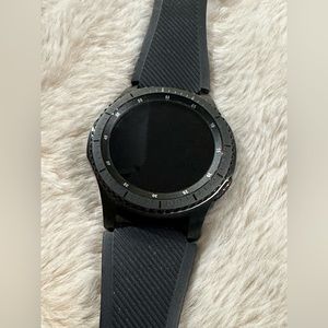 Samsung Black Smartwatch with charger.